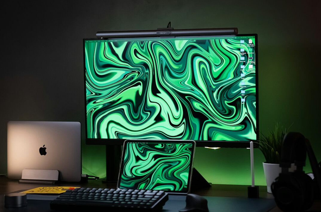 Dual monitor setup displaying programming code