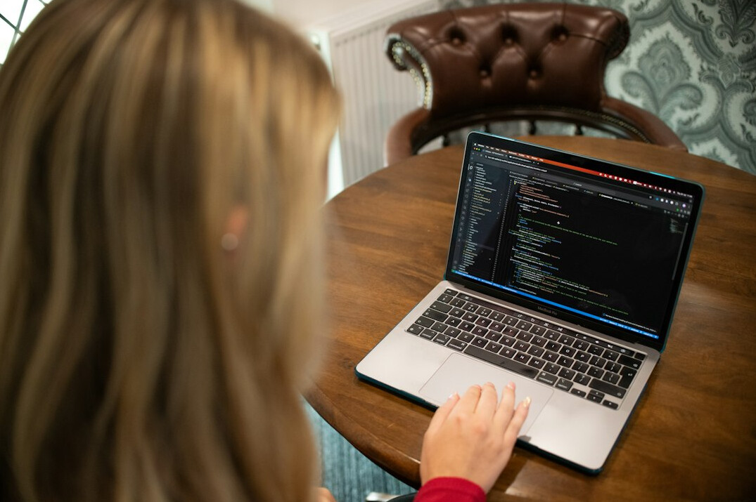 person learning coding on laptop